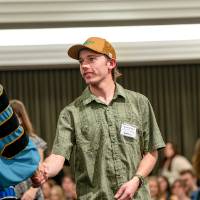 kid shaking dean hand